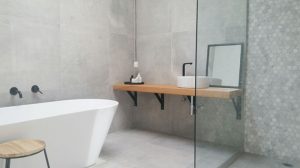 Reasons to Choose Concrete Look Tiles Over Poured Cement for Your Bathroom